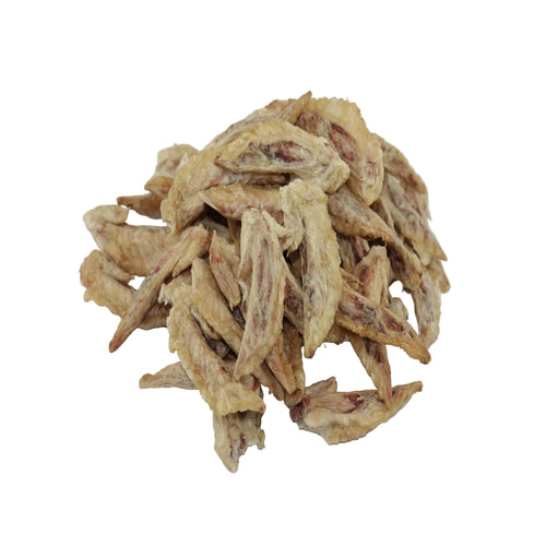 Chicken wing tips dog treats, in light tan and brown colors, set against a plain white background.