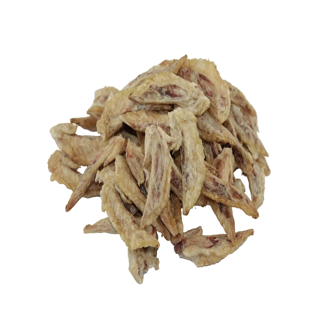 Chicken wing tips dog treats, in light tan and brown colors, set against a plain white background.