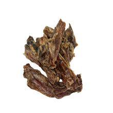Veal tail dog chews with a dark brown and reddish-brown texture, photographed on a plain white background.