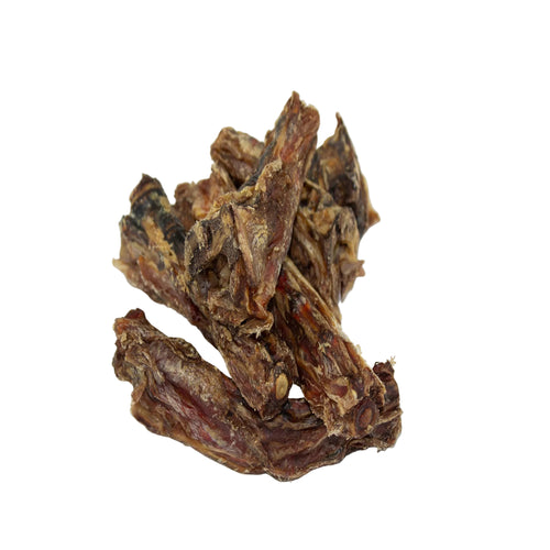 Veal tail dog chews with a dark brown and reddish-brown texture, photographed on a plain white background.